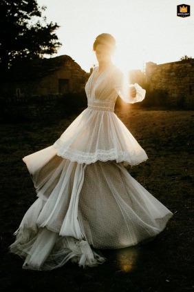 Bride Plays with Light in Stunning Dress at Terrasses de Majorac Wedding Photo Photo of a bride playing with the light in her gorgeous dress at Terrasses de Majorac.